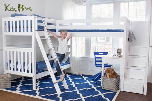 A boy standing on the ladder of a bunk bed