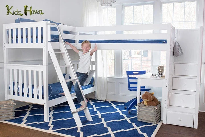 A boy standing on the ladder of a bunk bed